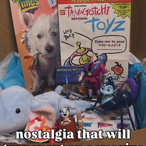 May include: A collection of 1990s McDonald's Happy Meal promotional materials and toys, including a Fun Times booklet, a Tamagotchi keychain advertisement, a small Independence Day card, a plush blue elephant, and various plastic character figures.