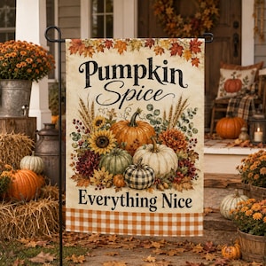 May include: A rectangular garden flag featuring the text Pumpkin Spice Everything Nice in black script and serif fonts. The design includes a central arrangement of orange, white, and buffalo plaid pumpkins, sunflowers, wheat, and autumn leaves.