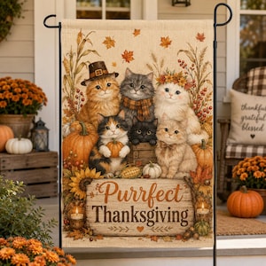 May include: A rectangular garden flag featuring a group of six kittens surrounded by pumpkins, corn, and autumn leaves. One kitten wears a pilgrim hat, another a scarf, and one a floral crown. The text Purrfect Thanksgiving is printed on a wooden sign.