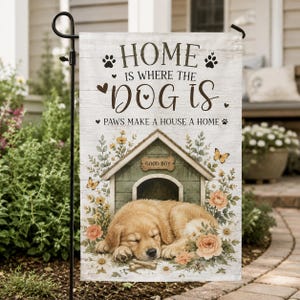 May include: A rectangular garden flag with a white wood-grain background featuring a sleeping golden puppy in front of a green doghouse. The text reads: HOME IS WHERE THE DOG IS. PAWS MAKE A HOUSE A HOME. A sign on the doghouse says GOOD BOY.