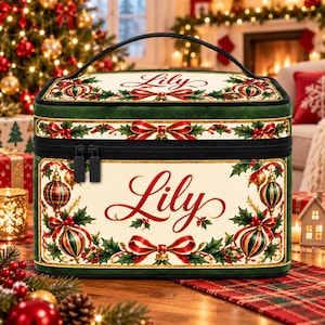 May include: A rectangular cosmetic case with a top handle and black zipper, featuring a cream-colored front and top panel printed with the name Lily in red script, surrounded by a festive pattern of holly leaves, red berries, and ornaments.