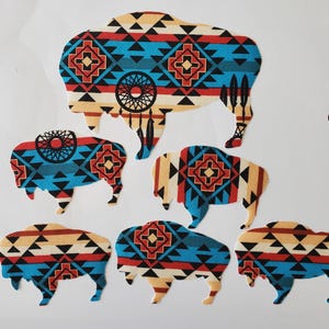 May include: Six different sized fabric buffalo cutouts with a Native American inspired geometric pattern in shades of blue, red, white, and black.