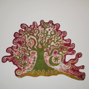 May include: A colorful tree design with a red and green color scheme. The tree has a green trunk and branches with red swirls and star-like shapes. The base is yellow, and the background is white.