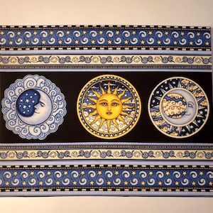May include: A decorative panel featuring celestial designs. The panel has a black background with three circular images of the sun, moon, and stars. The sun is yellow with a face, and the moons are white and blue. The panel is bordered with blue and white patterns.