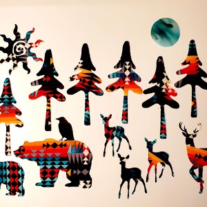 May include: Decorative wall art featuring a sun, trees, bears, deer, and a raven. The designs are in black, red, orange, and blue geometric patterns. A blue and green circular shape is also present.