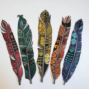 May include: Five decorative feathers with intricate patterns and vibrant colors. The feathers are in shades of red, green, yellow, orange, and blue, each with unique geometric and floral designs. The feathers are arranged against a white background.