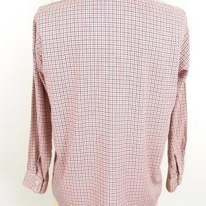 May include: A long-sleeved button-down shirt with a red and black checkered pattern.