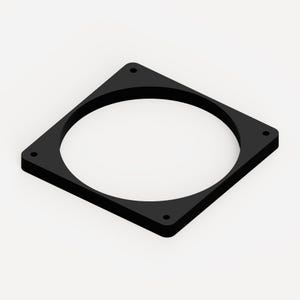 May include: A flat, square black mounting plate featuring a large circular cutout in the centre and four small, evenly spaced circular holes located near each of the four corners of the square frame, presented from an angled perspective.