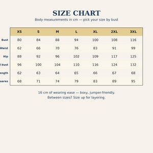 May include: A size chart table with the title SIZE CHART and the subtitle Body measurements in cm &mdash; pick your size by bust. The table lists sizes XS through 3XL with corresponding measurements for bust, waist, hip, full bust, length, and squares.