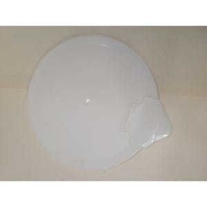 May include: A circular, semi-translucent white plastic lid featuring a small, integrated tab handle on one side. The lid has a smooth, flat surface with a subtle central indentation and a slightly raised outer rim for a secure fit on a container.