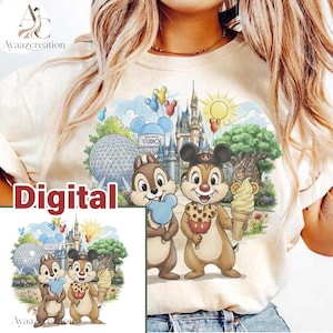 May include: A cream-colored t-shirt featuring a colorful graphic of two chipmunks holding ice cream treats. The background depicts a theme park with a castle, a geodesic dome, and a large tree. The text "Digital" is printed in red on the left side.