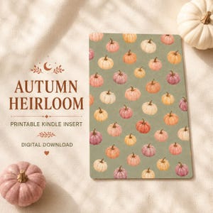 May include: A rectangular printable Kindle insert featuring a repeating pattern of small pumpkins in shades of orange, pink, and cream on a muted sage green background. The text reads AUTUMN HEIRLOOM PRINTABLE KINDLE INSERT DIGITAL DOWNLOAD.