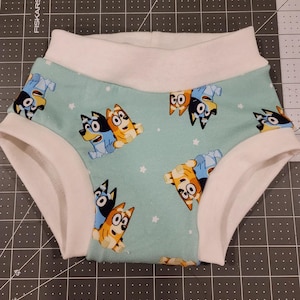 Pantalones de entrenamiento de tela azul para perros