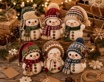 May include: Six crocheted snowman figurines, each wearing a unique winter hat and scarf. The snowmen feature white yarn bodies, orange carrot-shaped noses, and small buttons down the front. They are decorated with various festive accents like pom-poms, wooden hearts, and tiny gingerbread men.
