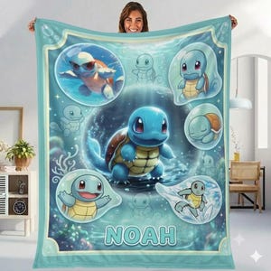 May include: A light blue fleece blanket featuring multiple illustrations of the blue turtle-like character Squirtle in various poses within bubbles, set against an underwater background with the name NOAH printed in large white letters.