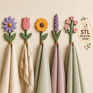 May include: Five wall-mounted flower-shaped hooks in purple, pink, yellow, lavender, and light pink, each with green stems and leaves. Each hook holds a hanging towel in various colours. Text on the right reads STL DIGITAL ITEM.