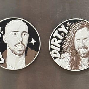 May include: Two circular magnets featuring stylised portraits. The left magnet shows a bald person with the text CLEAN and star icons. The right magnet shows a person with long hair and a beard with the text DIRTY and small bee illustrations.