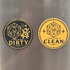 May include: Two circular magnets featuring gold designs on contrasting backgrounds. The left magnet is black with a gold 20-sided die, a bard figure, and the text DIRTY. The right magnet is gold with a black 20-sided die and the text CLEAN.