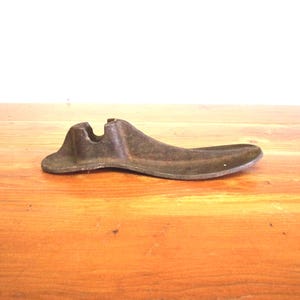Antique cast iron shoe form primitive home decor door stop