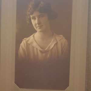 Vintage black and white sepia portrait of a young lady flapper girl picture