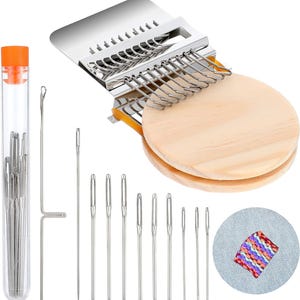 May include: A darning loom tool with a round wooden base and metal hooks, a clear plastic tube containing multiple sewing needles, a long metal needle, and a small circular fabric swatch featuring a multi-colored woven pattern.