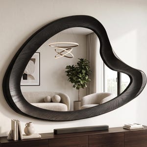 Asymmetrical organic wood wall mirror with a sculptural wavy frame, handcrafted natural wood design for modern, rustic, boho, and minimalist home decor.