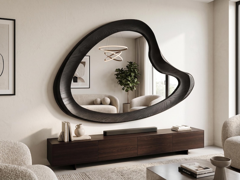 Asymmetrical organic wood wall mirror with a sculptural wavy frame, handcrafted natural wood design for modern, rustic, boho, and minimalist home decor.