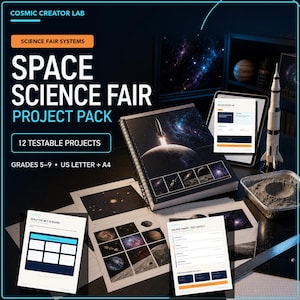 May include: A Space Science Fair Project Pack by Cosmic Creator Lab featuring a spiral-bound workbook with a rocket launch cover, multiple printed project sheets, a model rocket, a lunar surface tray, and a ruler on a dark surface.