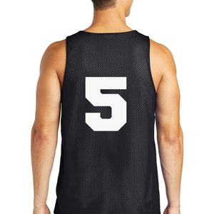 May include: Black basketball jersey with a white mesh design and the number 5 printed on the back.
