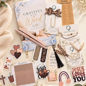 May include: A collection of religious stationery including a Grateful in the Word devotional book, a leopard print bow paperclip, a Bible emergency numbers card, a beaded bracelet, stickers with text like Jesus Loves You, and bookmarks with tassels.