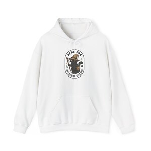 May include: A white hooded sweatshirt featuring a central graphic of a black cat wearing a brown wizard hat, holding a wooden staff, and carrying a small satchel. The text "HERE FOR OPTIONAL QUESTS" is printed in a black oval border around the cat.