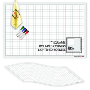 May include: A white dry-erase battle mat with a 1-inch grid, rounded corners, and lightened borders. The mat is flat and has a slight sheen. The text "it's a SKIN" is printed in the bottom right corner.