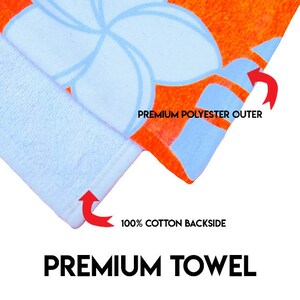 May include: Close-up of a blue and orange beach towel with a floral pattern. The towel has a 100% cotton backside and a premium polyester outer. The text "PREMIUM TOWEL" is printed on the bottom of the image.