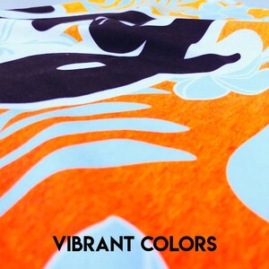 May include: A close-up of a fabric with a vibrant orange, blue, and black pattern. The fabric has a textured surface and features a repeating design of stylized leaves and flowers. The text "VIBRANT COLORS" is printed in black at the bottom of the image.