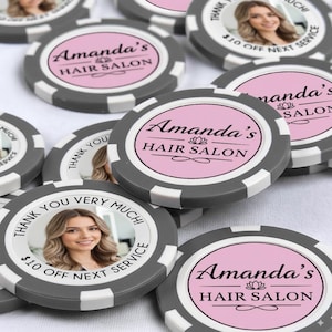May include: Gray and white poker chips with the text "Amanda's Hair Salon" in black and pink. Some chips have a photo of a woman and the text "Thank you very much!" and "$10 off next service".