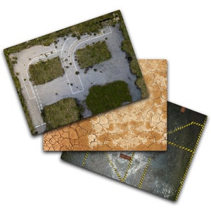 May include: Three different textured gaming mats. The first mat is a gray concrete surface with white painted lines and green grass growing in the cracks. The second mat is a brown cracked earth surface. The third mat is a dark gray concrete surface with yellow and black warning stripes.