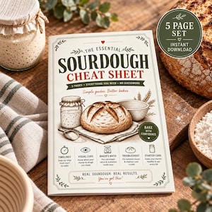 May include: A printed guide titled The Essential Sourdough Cheat Sheet featuring illustrations of a sourdough starter jar, a loaf of bread, and a mixing bowl. The cover includes text about timelines, visual cues, baker's math, and troubleshooting.