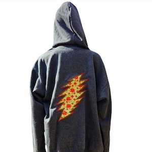 May include: A dark gray hooded sweatshirt with a yellow lightning bolt design on the back. The lightning bolt is filled with a pattern of red and green mushrooms.