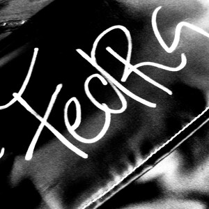 May include: Black fabric bag with white stitching and the words "FedEx" and "FedEx" written in white.