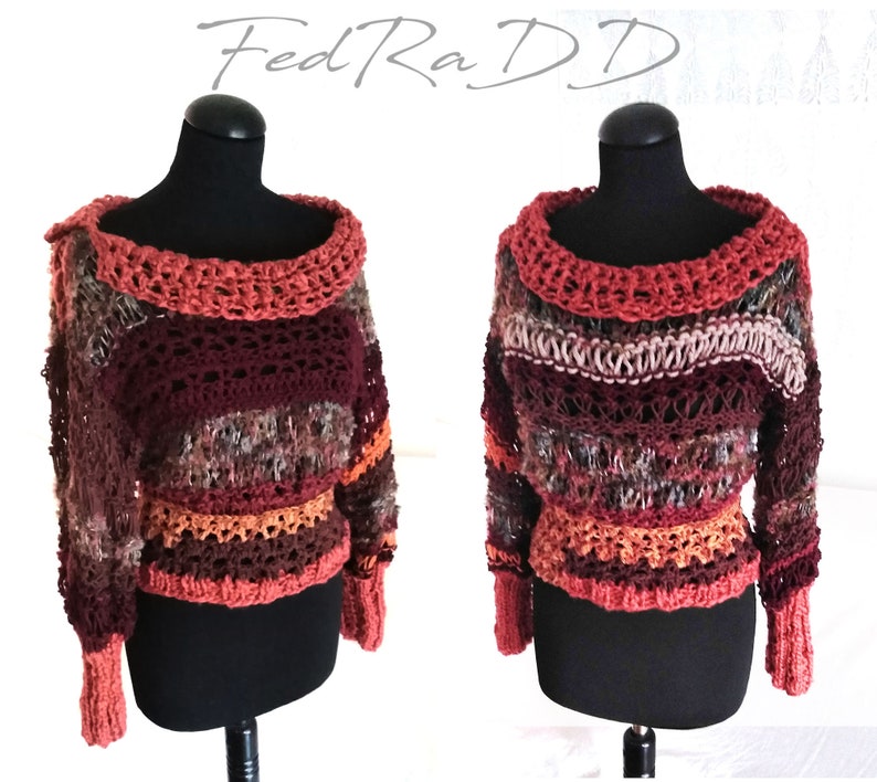 May include: A handmade, off-the-shoulder crochet sweater in shades of burgundy, brown, orange, and cream. The sweater features a wide, open neckline and long sleeves with ribbed cuffs. The text "FedRaDD" is in the upper left corner.