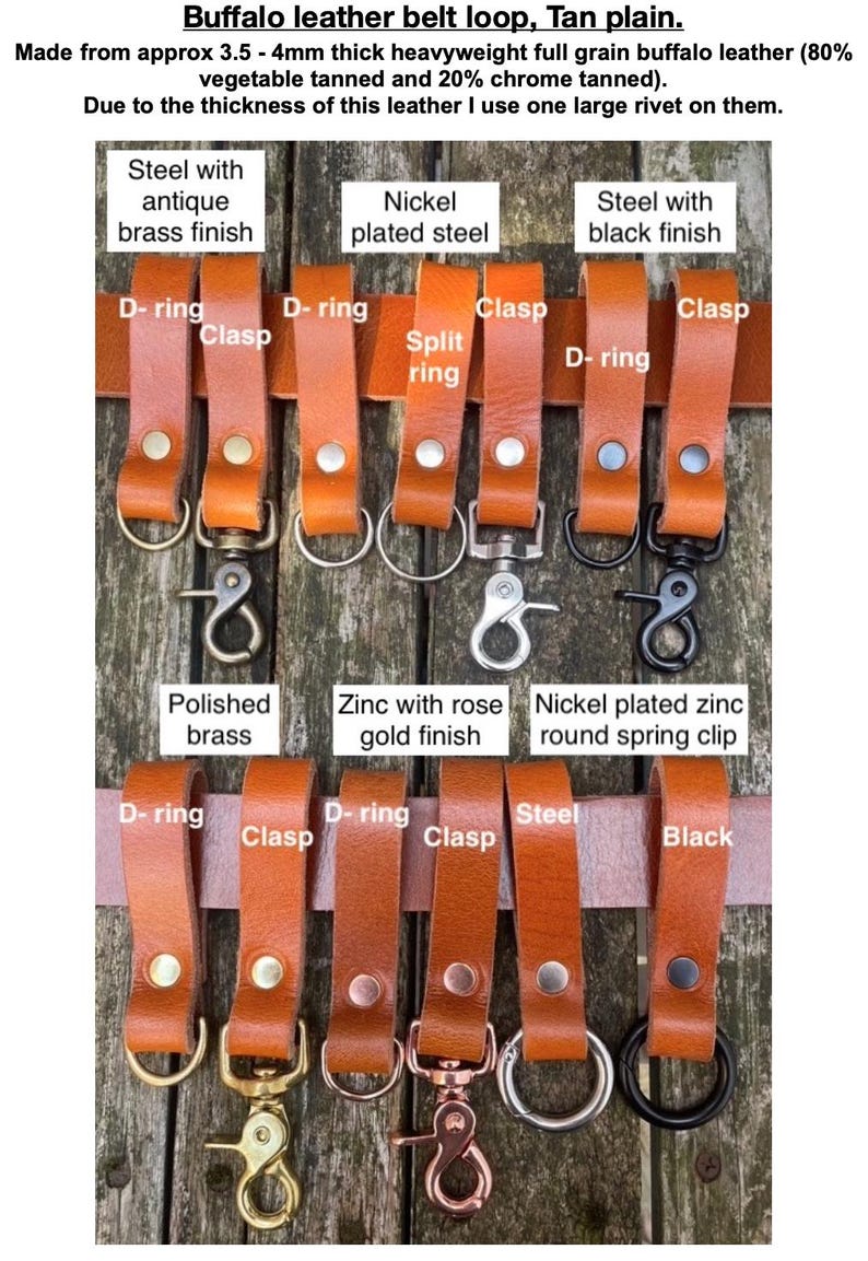May include: A collection of tan buffalo leather belt loops featuring various metal hardware attachments including D-rings, clasps, split rings, and spring clips in finishes such as antique brass, nickel, black, polished brass, and rose gold.