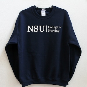 May include: Navy blue sweatshirt with white text that reads "NSU | College of Nursing".