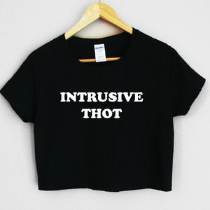 May include: Black cropped t-shirt with white text that reads "Intrusive Thot".