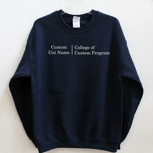 May include: Navy blue sweatshirt with white text that reads "Custom Uni Name | College of Custom Program".