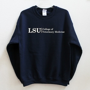 May include: Navy blue sweatshirt with white text that reads "LSU College of Veterinary Medicine".