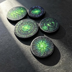 May include: Five circular game tokens featuring intricate, dark gray and black surfaces with glowing neon green patterns. Each token displays unique, detailed engravings, including geometric shapes, radial lines, and swirling, organic textures.
