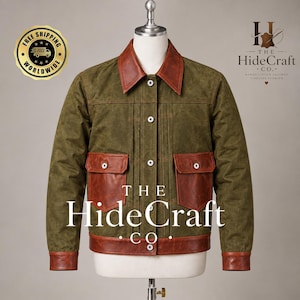 May include: A jacket featuring an olive green body with contrasting brown leather accents on the collar, cuffs, hem, and two front flap pockets. The garment includes a central button-down closure with white buttons and vertical stitched detailing.