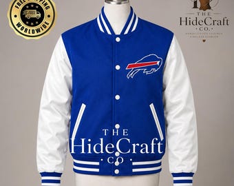 May include: A blue varsity jacket with white sleeves, featuring a white and red buffalo logo on the chest. The jacket has a snap-button front closure, white striped ribbed cuffs, a striped collar, and two side pockets with white trim details.