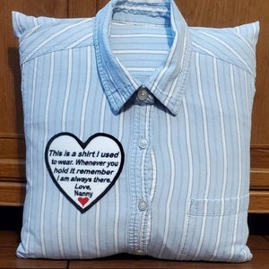 May include: A blue and white striped pillow with a heart-shaped patch that says "This is a shirt I used to wear. Whenever you hold it remember I am always there. Love, Nanny".