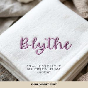 May include: A white fabric surface featuring the embroidered name Blythe in a purple cursive script. Text below the name specifies 5 sizes of 2.54 cm, 3.81 cm, 5.08 cm, 6.35 cm, and 7.62 cm, along with file formats PES, DST, EXP, JEF, VP3, and BX FONT.